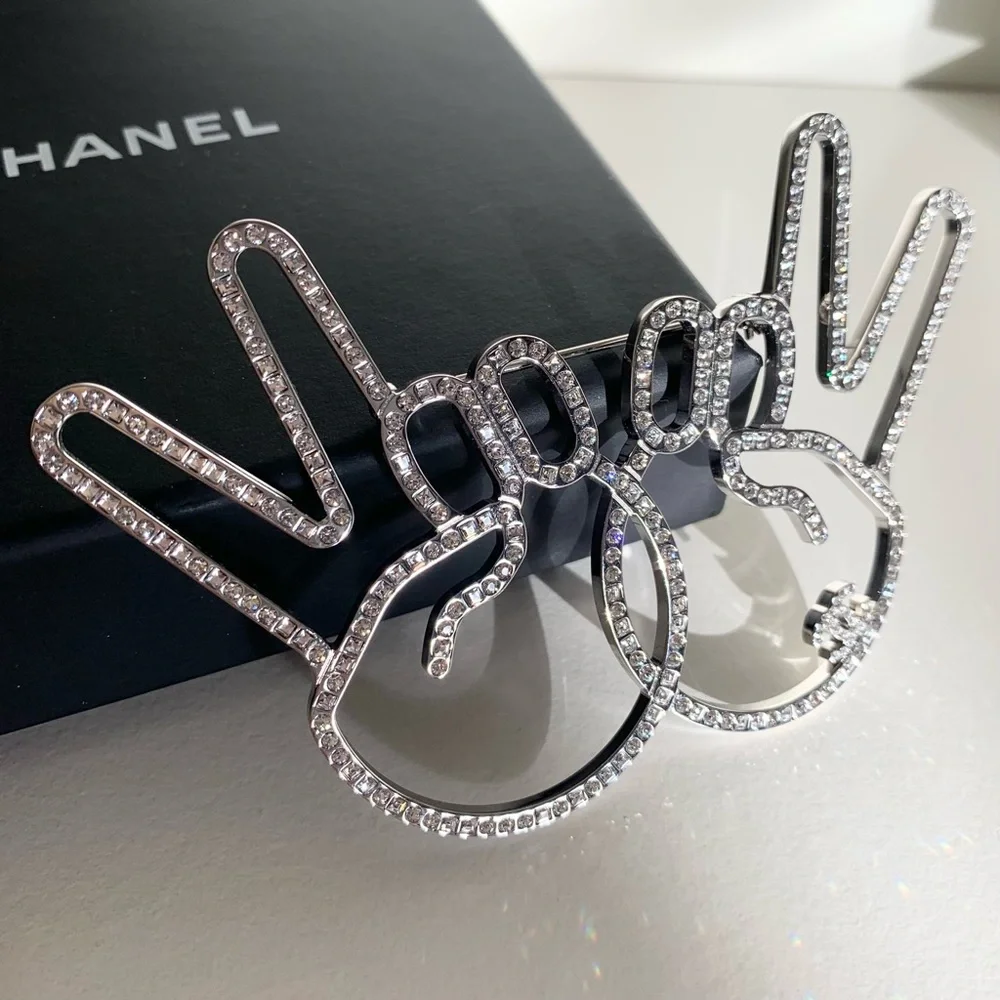 Chanel large peace hands pin